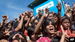 Rohingya refugee children shout slogans during a protest against repatriation efforts, Unchiprang refugee camp near Cox's Bazar, Bangladesh, Nov. 15, 2018. 