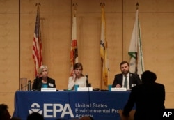 The U.S. Environmental Protection Agency's Deborah Jordan, seated from left, Preston Cory and Aaron Ringel listen to a speaker at an Environmental Protection Agency listening session in San Francisco, Feb. 28, 2018.