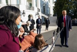 U.S. President Donald Trump speaks to the press as he departs the White House on travel to visit the U.S.-Mexico border Wall in Texas, in Washington, U.S., January 12, 2021. REUTERS/Kevin Lamarque