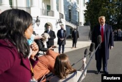 U.S. President Donald Trump speaks to the press as he departs the White House on travel to visit the U.S.-Mexico border Wall in Texas, in Washington, U.S., January 12, 2021. REUTERS/Kevin Lamarque