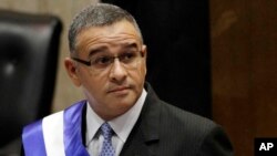 In this June 1, 2012 file photo, El Salvador's President Mauricio Funes stands in the National Assembly before speaking to commemorate the anniversary of his third year in office in San Salvador, El Salvador. The Nicaraguan government said Tuesday, Sept. 6, 2016 that it has given political asylum to the former El Salvador president.