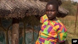 Nighti Aparo stands in her village in northern Uganda. Aparo was kidnapped, raped at gunpoint and tortured by the Lords Resistance Army. (OXFAM handout, file photo)