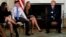 Parent Melissa Blank, from left, and Marjory Stoneman Douglas High School shooting surviving students Jonathan Blank and Julia Cordover attend with other survivors and the families of victims a listening session held by U.S. President Donald Trump to discuss school safety and shootings, at the White House in Washington, Feb. 21, 2018. 