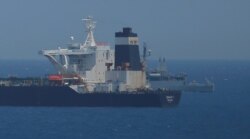 FILE - Oil supertanker Grace 1 sits anchored in waters of the British overseas territory of Gibraltar.