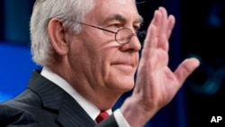 Secretary of State Rex Tillerson waves goodbye after speaking at a news conference at the State Department in Washington, March 13, 2018. President Trump fired Tillerson on Tuesday.
