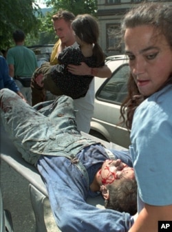 FILE - Victims of the shelling in downtown Sarajevo are brought to Kosevo Hospital in Sarajevo, August 28, 1995.