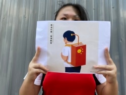香岛中学四年级学生陈同学参与6-12人链行动，她表示要反抗学校的”红色”教育。 (美国之音/汤惠芸)