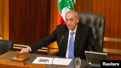 Lebanese Parliament speaker Nabih Berri strikes his gavel at the end of a parliamentary session in parliament in Beirut, May 31, 2013.
