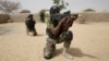 FILE - Nigerian special forces guard a compound as they participate in an hostage rescue exercise at the end of the Flintlock exercise in Mao, Chad, March 7, 2015. 