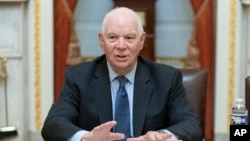 FILE - Senator Ben Cardin talks to reporters at the Capitol in Washington, Sept. 28, 2023.