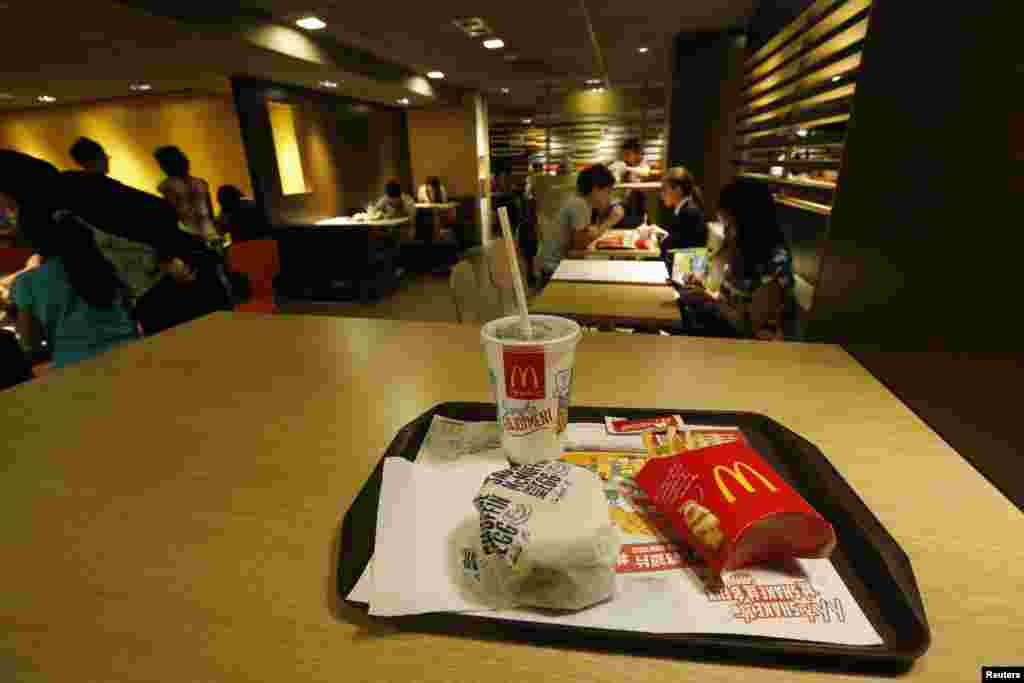 A burger set is on display at a McDonald&#39;s restaurant in Hong Kong. Many consumers in Shanghai, Beijing and Hong Kong say they plan to scale back their visits to McDonald&#39;s, at least for now, but noted that the low prices make it hard to give up.