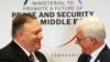 Poland's Minister of Foreign Affairs Jacek Czaputowicz, right and U.S. Secretary of State Mike Pompeo shake hands at the end of a conference on promoting security in the Middle East that Poland co-hosted with the United States, in Warsaw, Feb. 14, 2019.