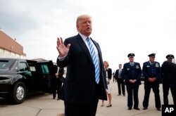 President Donald Trump speaks to the media as he steps off Air Force One, Aug. 21, 2018, in Charleston, W.Virginia.