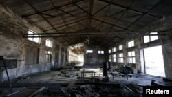 FILE - A closed brick factory building on the outskirts of Beijing, China, Jan. 18, 2016. Chinese manufacturing ebbed in January to its lowest in more than three years, a possible sign of further weakness in the world's No. 2 economy.