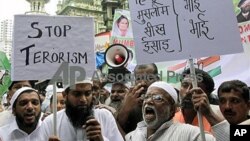 FILE - Indian Muslims shout slogans against terrorism during the protest against a September 7 blast outside a courthouse in New Delhi, in Mumbai, India, September 2011.