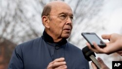 FILE - Commerce Secretary Wilbur Ross speaks to reporters outside the White House in Washington.