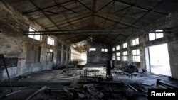 FILE - A closed brick factory building is seen on the outskirts of Beijing, China, Jan. 18, 2016. Chinese manufacturing ebbed in January to its lowest in more than three years, a possible sign of further weakness in the world's No. 2 economy.