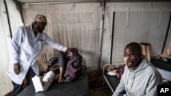 Medics treat a man wounded during fighting between Congolese government troops and M23 rebel forces in Goma's Kyeshero hospital, Feb. 1, 2025.