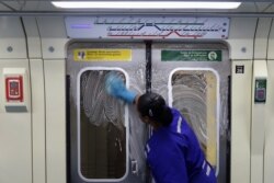 A cleaner works on the disinfection of a subway train as a measure against the coronavirus disease (COVID-19) in Sao Paulo, Brazil, March 17, 2020.