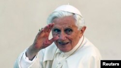 Pope Benedict XVI waves as he arrives to lead the Wednesday general audience in Saint Peter's square, at the Vatican October 24, 2012.