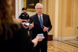 Senate Majority Leader Mitch McConnell of Ky. speaks to reporters outside the Senate chamber after Democrats block a coronavirus aid package on Capitol Hill, Monday, March 23, 2020, in Washington.