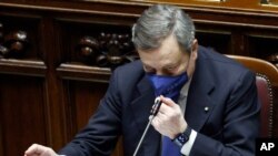 FILE - Italy's Prime Minister Mario Draghi addresses the Lower Chamber of the Italian Parliament, in Rome, Feb. 18, 2021, ahead of a confidence vote that would mark the start of his government. 