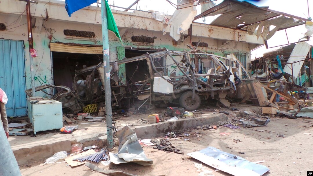 FILE - The wreckage of a bus remains at the site of an airstrike in Saada, Yemen, Aug. 10, 2018. 