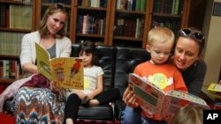 Doctors say reading aloud to children is the best way to raise life-long readers. (Jack Plunkett/AP Images)