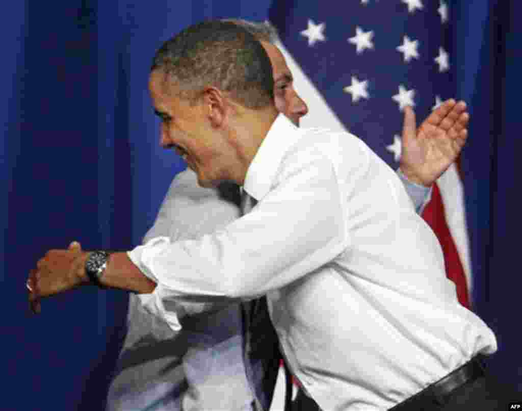 President Barack Obama hugs Chicago Mayor Rahm Emanuel before he speaks at a fundraiser on the eve of his 50th birthday, Wednesday, Aug. 3, 2011, in Chicago. (AP Photo/M. Spencer Green)