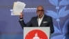 Venezuelan National Assembly leader Jorge Rodriguez holds up a document signed by former opposition presidential candidate Edmundo Gonzalez during a press conference at the legislative palace in Caracas, Venezuela, Sept. 18 2024.