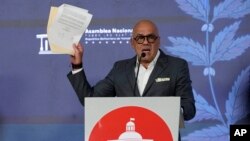 Venezuelan National Assembly leader Jorge Rodriguez holds up a document signed by former opposition presidential candidate Edmundo Gonzalez during a press conference at the legislative palace in Caracas, Venezuela, Sept. 18 2024.