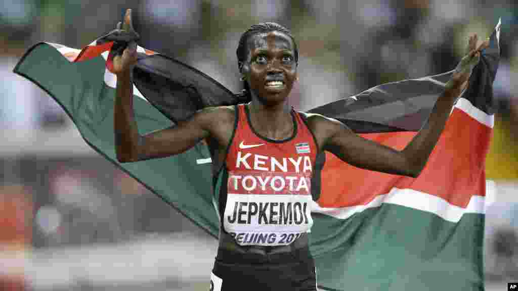 Kenya&#39;s Hyvin Jepkemoi celebrates after winning the women&#39;s 3000m steeplechase final at the World Athletics Championships at the Bird&#39;s Nest stadium in Beijing, Wednesday, Aug. 26, 2015.