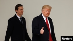 U.S. President Donald Trump gives a thumbs-up as he and White House Senior Advisor Jared Kushner depart the White House in Washington, March 15, 2017.