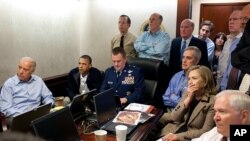 President Barack Obama and Vice President Joe Biden, along with national security team members, receive updates on the mission against Osama bin Laden, White House Situation Room, May 1, 2011. (AP/The White House)