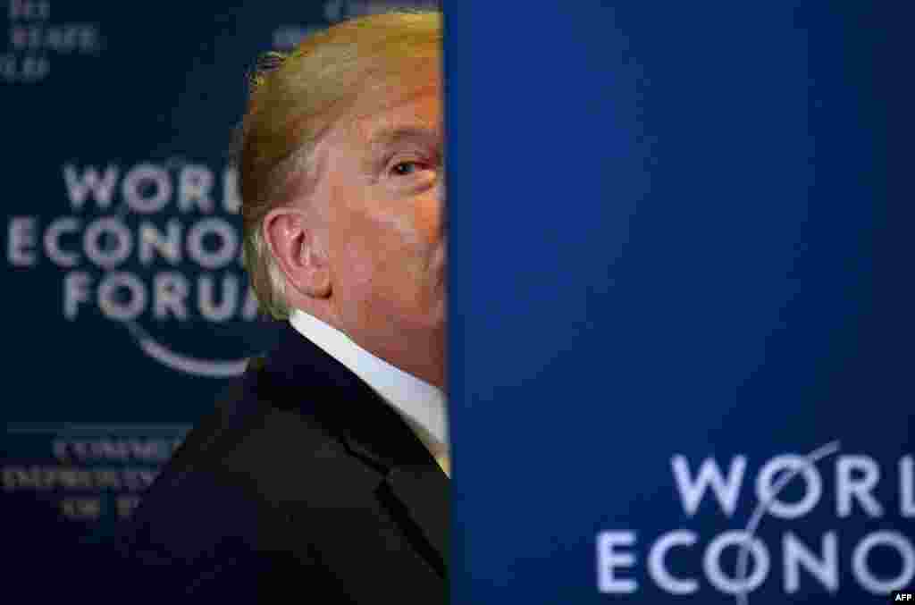 U.S. President Donald Trump looks back as a question from the press is shouted after a press conference at the World Economic Forum in Davos, Switzerland.