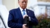 FILE - President Donald Trump holds a Bible as he visits outside St. John's Church across Lafayette Park from the White House, June 1, 2020.