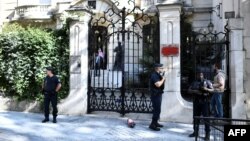 FILE - French police stand guard outside the Iranian Embassy in the French capital Paris on Sept. 14, 2018 following a demonstration nearby.