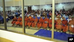 Buddhist monks and other people sit at the Extraordinary Chambers in the Courts of Cambodia (ECCC) on the outskirts of Phnom Penh, file photo. 