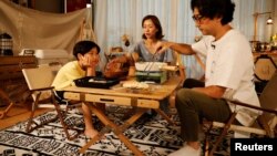 Lee Seung-yoon cooks during a staycation at his family's home amid the coronavirus disease (COVID-19) pandemic, in Seoul, South Korea, August 22, 2020. (REUTERS/Kim Hong-Ji)