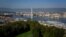 FILE - An aerial view from the 'Parc La Grange' of the Geneva landscape with the Jet d'Eau fountain on Lake Geneva, Sept. 14, 2019.