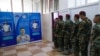 FILE - Kurdish Peshmerga soldiers take part in a voting simulation to test the efficiency of the system and the tools, ahead of Kurdistan parliamentary elections scheduled for October 2024, in Irbil on Aug. 29, 2024.