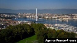 FILE - An aerial view from the 'Parc La Grange' of the Geneva landscape with the Jet d'Eau fountain on Lake Geneva, Sept. 14, 2019.