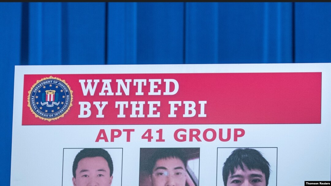 Boletín con fotografía de sospechosos acusados por el Departamento de Justicia de EE.UU. de una campaña global de intrusión informática.