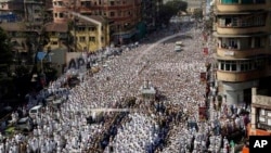 A pre-dawn stampede killed more than a dozen people Saturday as thousands of Indian Muslims joined the funeral procession of the head of the Dawoodi Bohra Muslim community Syedna Mohammed Burhanuddin in Mumbai, India, Saturday, Jan. 18, 2014. 