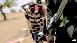 A Sudanese soldier patrols following clashes between the army and South Sudan's forces in the town of Talodi in South Kordofan, about 50 kms (30 miles) from the disputed frontier with South Sudan, on April 12, 2012.