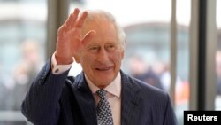 FILE: King Charles waves as visits the new European Bank for Reconstruction and Development (EBRD) in London on March 23, 2023.