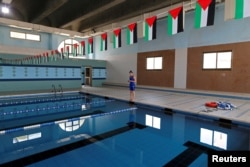 Palestinian swimmer Mary Al-Atrash, shown training in Beit Sahour, near the West Bank town of Bethlehem, June 27, 2016, will represent Palestine in the 50-meter freestyle at the 2016 Rio Olympics.