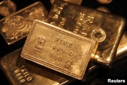 FILE - Gold prices have risen because of interest rates around the world.