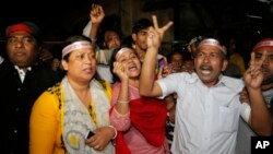 Bangladeshi activists celebrate the execution of two war criminals Nov. 22, 2015, in Dhaka, Bangladesh. 