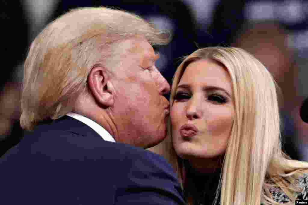 U.S. President Donald Trump is greeted by White House Senior Adviser, and his daughter, Ivanka Trump at a campaign rally in Manchester, New Hampshire, Feb. 10, 2020.